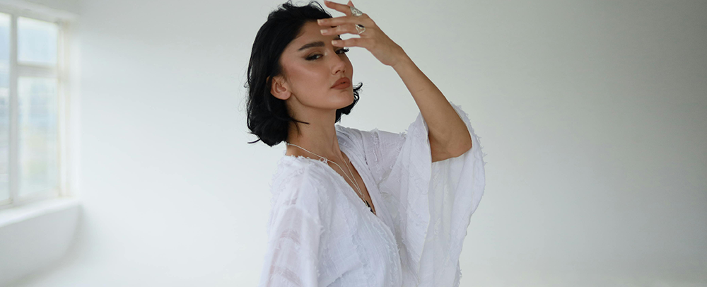 Photo by optical service: https://www.pexels.com/photo/elegant-woman-posing-in-minimalist-white-studio-34534926/